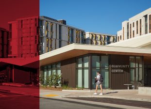 The community center sits in front of the residential buildings