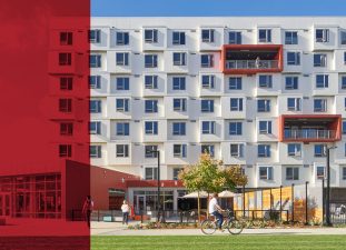 View of one of the residential building’s exterior façades and the marketplace on the first floor