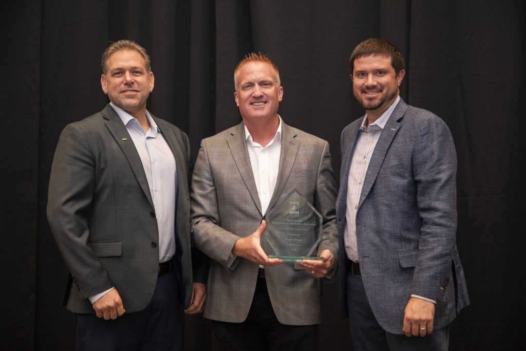 Cory Olson, Greg Jennings and Kevin Curry accepting the Honor Award from the DBIA Florida Region.