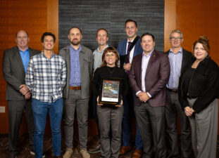 University of Washington Interdisciplinary Engineering Building team holding an award from the ENR Awards.