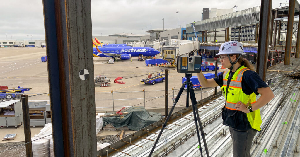 Hensel Phelps employee using reality capture and laser scanning