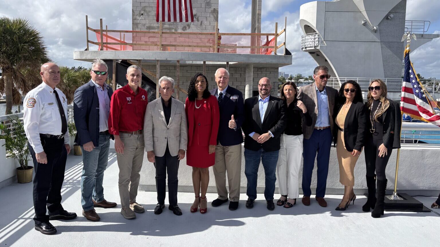 Group photo of Hensel Phelps employees with clients. 