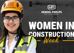 Women in Construction Week featuring a woman wearing a construction helmet