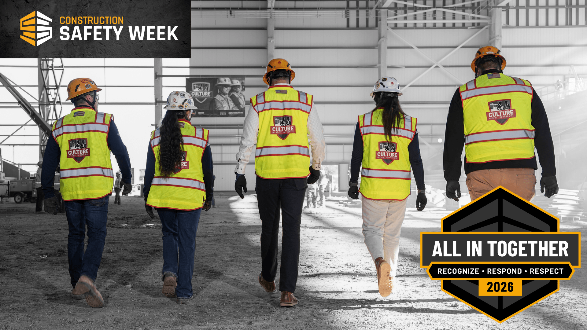 Hensel Phelps construction team walks in PPE with Construction Safety Week 2026 logos