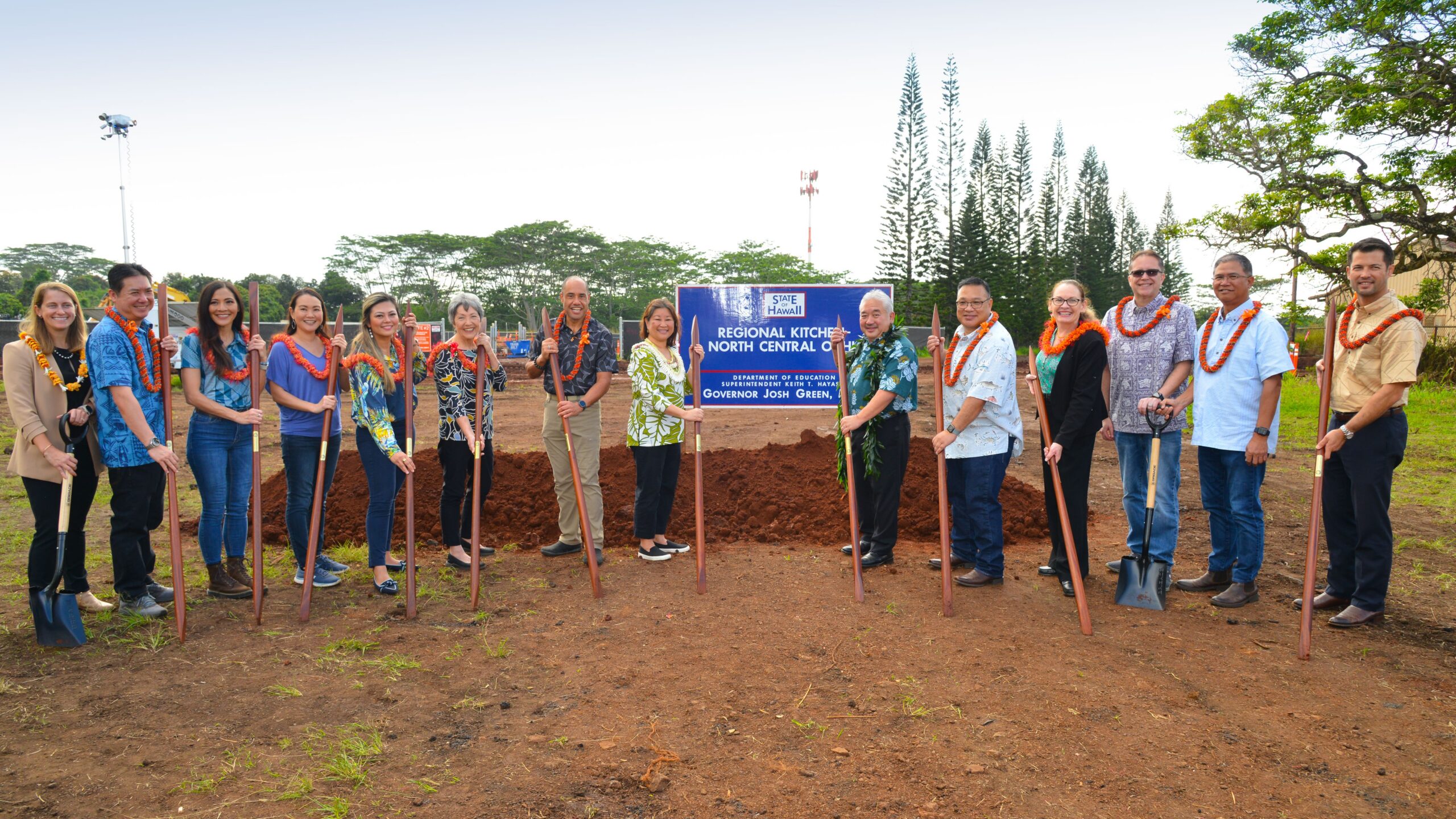 groundbreaking participants hold shovels next to sign that says "Regional Kitchen North Central Oahu