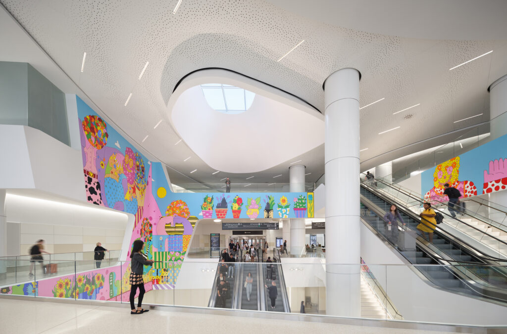 A pre-security departure space featuring the oculus and a mural by local San Francisco artist Craig Calderwood.