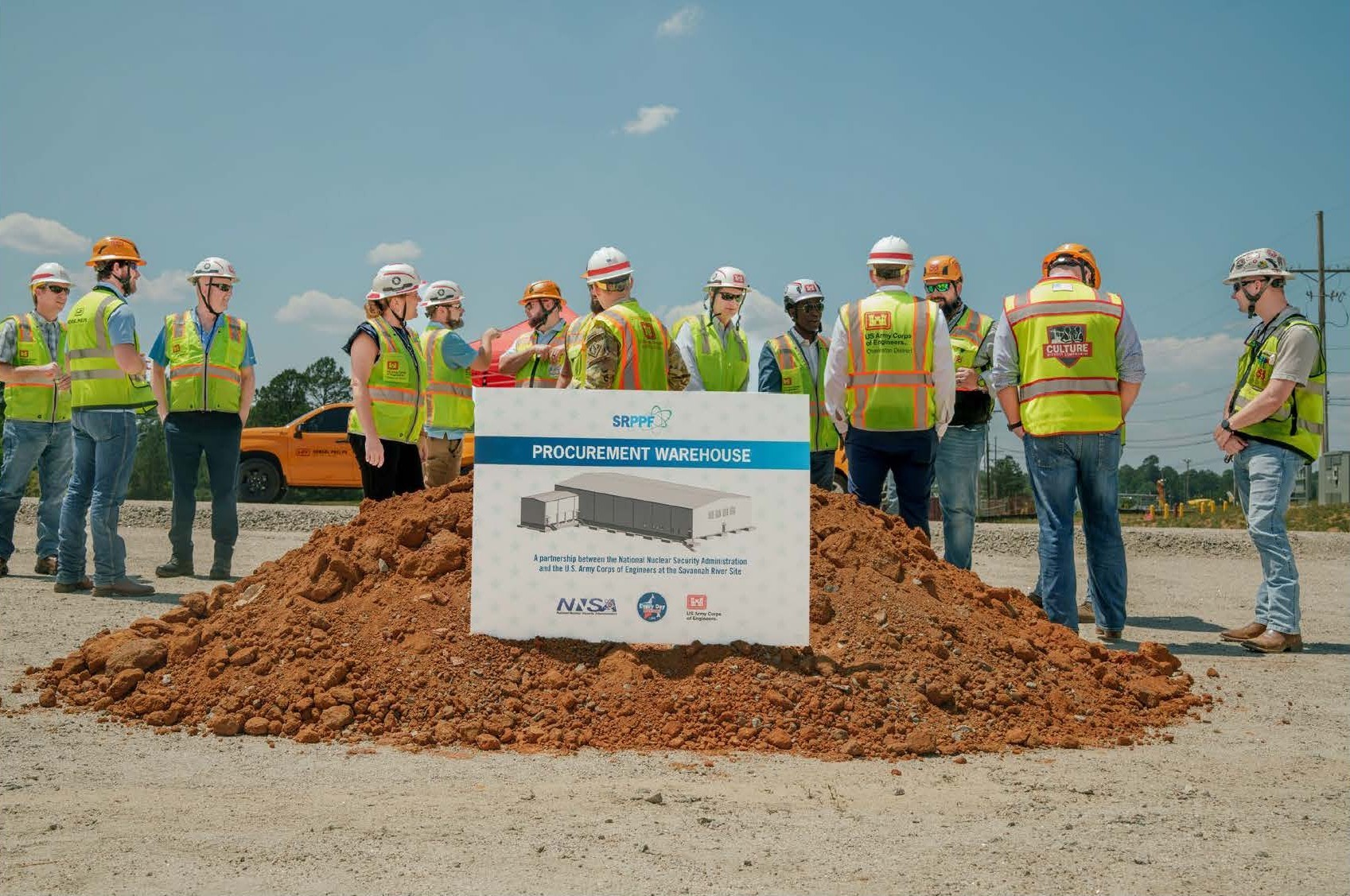 Group of people celebrating the Y810 project groundbreaking