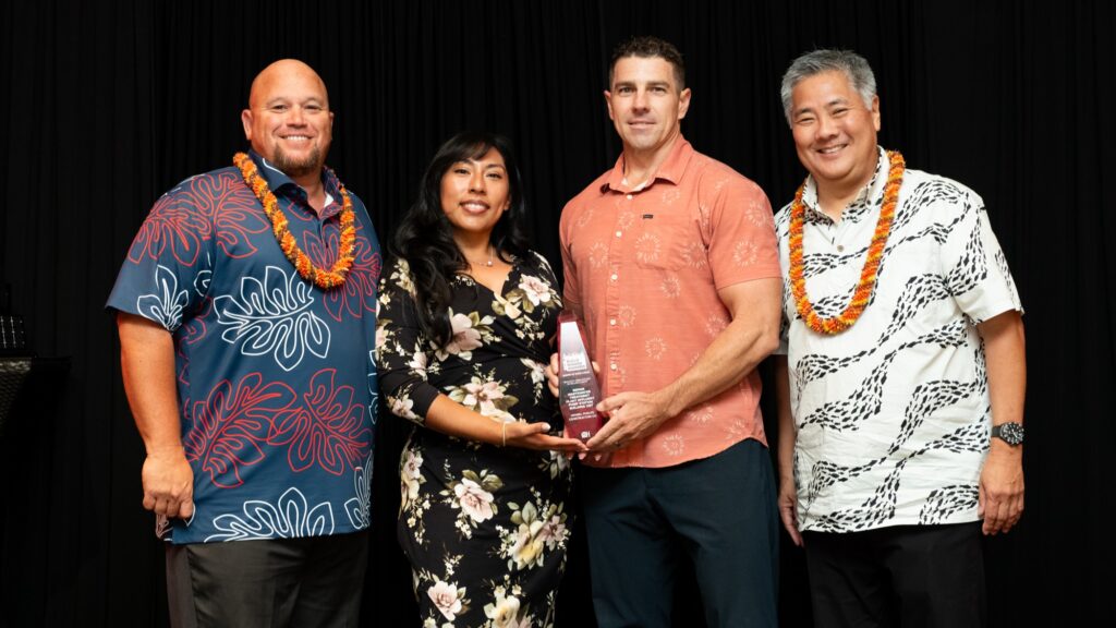 Three Hensel Phelps representatives pose with the Build Hawaii Award of Excellence for the Repair Wastewater Treatment Plant Effluent Pump Station Building 1357 project.