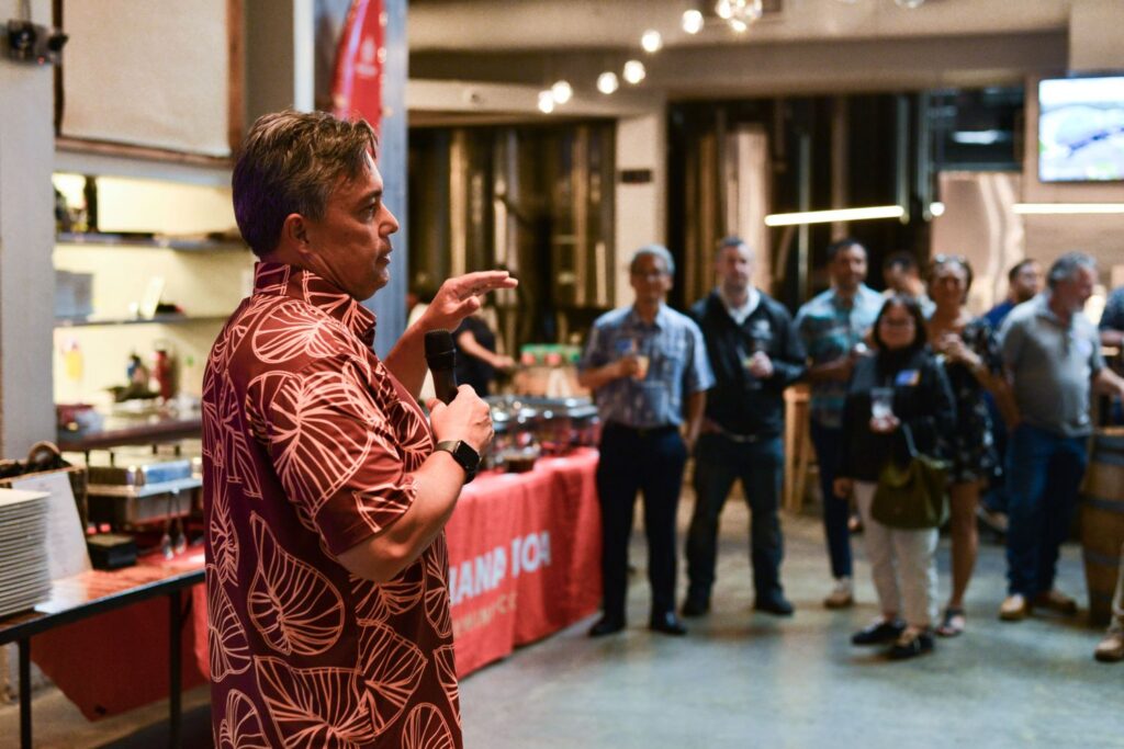 Guests enjoy food, refreshments, and conversation at a Partner Appreciation event in Hawaii.