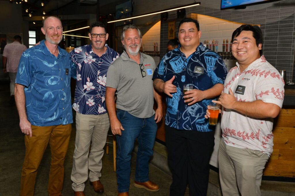 Guests enjoy food, refreshments, and conversation at a Partner Appreciation event in Hawaii.