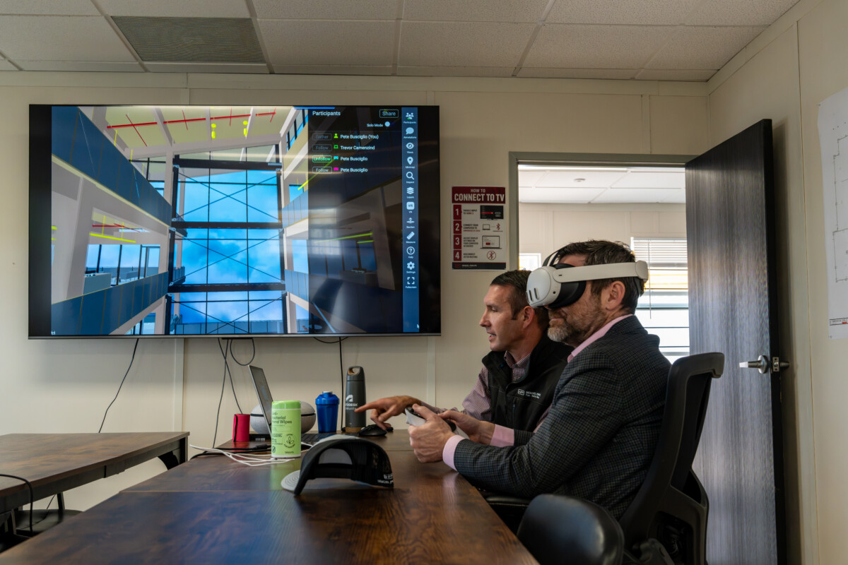 Hensel Phelps employees view a 3D model of the new headquarters using virtual reality headsets